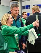 16 October 2023; Captain Jonathan Sexton poses for a selfie with supporter on the Ireland rugby teams arrival at Dublin Airport from the 2023 Rugby World Cup in France. Photo by Piaras Ó Mídheach/Sportsfile