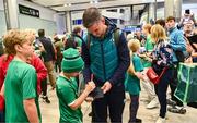 16 October 2023; Captain Jonathan Sexton signs an autograph for a supporter on the Ireland rugby teams arrival at Dublin Airport from the 2023 Rugby World Cup in France. Photo by Piaras Ó Mídheach/Sportsfile