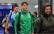 16 October 2023; Ireland players Ryan Baird, centre, and teammates Joe McCarthy, left, and Andrew Porter on the Ireland rugby arrival return at Dublin Airport from the 2023 Rugby World Cup in Paris, France. Photo by Piaras Ó Mídheach/Sportsfile