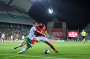 16 October 2023; John Sergeant of Gibraltar in action against Jamie McGrath of Republic of Ireland during the UEFA EURO 2024 Championship qualifying group B match between Gibraltar and Republic of Ireland at Estádio Algarve in Faro, Portugal. Photo by Stephen McCarthy/Sportsfile