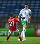 16 October 2023; Dara O'Shea of Republic of Ireland in action against Jamie Coombes of Gibraltar during the UEFA EURO 2024 Championship qualifying group B match between Gibraltar and Republic of Ireland at Estádio Algarve in Faro, Portugal. Photo by Stephen McCarthy/Sportsfile