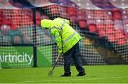 17 October 2023; A groundsman attempts to clear surface water off the pitch before the UEFA European U17 Championship qualifying round 10 match between Switzerland and Republic of Ireland at Turner's Cross in Cork. Photo by Eóin Noonan/Sportsfile