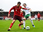 17 October 2023; Eman Kospo of Switzerland in action against Niall McAndrews of Republic of Ireland during the UEFA European U17 Championship qualifying round 10 match between Switzerland and Republic of Ireland at Turner's Cross in Cork. Photo by Eóin Noonan/Sportsfile