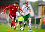 17 October 2023; Niall McAndrews of Republic of Ireland in action against Eman Kospo of Switzerland during the UEFA European U17 Championship qualifying round 10 match between Switzerland and Republic of Ireland at Turner's Cross in Cork. Photo by Eóin Noonan/Sportsfile