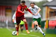 17 October 2023; Niall McAndrews of Republic of Ireland in action against Eman Kospo of Switzerland during the UEFA European U17 Championship qualifying round 10 match between Switzerland and Republic of Ireland at Turner's Cross in Cork. Photo by Eóin Noonan/Sportsfile