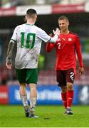 17 October 2023; Mason Melia of Republic of Ireland and Yannick Niedermann of Switzerland after the UEFA European U17 Championship qualifying group 10 match between Switzerland and Republic of Ireland at Turner's Cross in Cork. Photo by Eóin Noonan/Sportsfile
