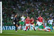 16 October 2023; Matt Doherty of Republic of Ireland heads his side's third goal past Gibraltar goalkeeper Dayle Coleing during the UEFA EURO 2024 Championship qualifying group B match between Gibraltar and Republic of Ireland at Estádio Algarve in Faro, Portugal. Photo by Stephen McCarthy/Sportsfile