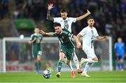 17 October 2023; Paul Smyth of Northern Ireland in action against Petar Stojanovic of Slovenia during the UEFA EURO 2024 Championship qualifying group H match between Northern Ireland and Slovenia at the National Football Stadium at Windsor Park in Belfast. Photo by Ramsey Cardy/Sportsfile