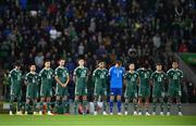 17 October 2023; The Northern Ireland team during a minute's silence before the UEFA EURO 2024 Championship qualifying group H match between Northern Ireland and Slovenia at the National Football Stadium at Windsor Park in Belfast. Photo by Ramsey Cardy/Sportsfile