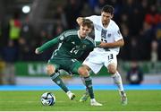 17 October 2023; Isaac Price of Northern Ireland in action against Erik Janža of Slovenia during the UEFA EURO 2024 Championship qualifying group H match between Northern Ireland and Slovenia at the National Football Stadium at Windsor Park in Belfast. Photo by Ramsey Cardy/Sportsfile