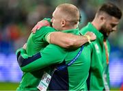 14 October 2023; Keith Earls of Ireland, right, consoles teammate Hugo Keenan after their side's defeat in the 2023 Rugby World Cup quarter-final match between Ireland and New Zealand at the Stade de France in Paris, France. Photo by Brendan Moran/Sportsfile