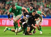 14 October 2023; Aaron Smith of New Zealand is tackled by Ireland players, from left, Iain Henderson, Caelan Doris and Josh van der Flier during the 2023 Rugby World Cup quarter-final match between Ireland and New Zealand at the Stade de France in Paris, France. Photo by Brendan Moran/Sportsfile