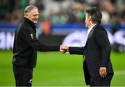 14 October 2023; New Zealand assistant coach Joe Schmidt, left, and World Rugby head of match officials Joel Jutge before the 2023 Rugby World Cup quarter-final match between Ireland and New Zealand at the Stade de France in Paris, France. Photo by Brendan Moran/Sportsfile