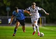 12 October 2023; Danny Grant of Bohemians in action against Evan Osam of UCD during the SSE Airtricity Men's Premier Division match between UCD and Bohemians at UCD Bowl in Dublin. Photo by Ben McShane/Sportsfile