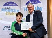 20 October 2023; The GAA is thrilled to announce and honor GAA clubs with the official &quot;Healthy Club&quot; designation. In recent years, Leinster clubs have actively taken part in the GAA's prominent Healthy Clubs pilot program, generously supported by Irish Life. Pictured is Mary Hanley of the Coolderry GAA club in Offaly being presented with their foundation award by Leinster Council health and wellbeing chairperson Dave Murray at the Killeshin Hotel in Portlaoise, Laois. Photo by Brendan Moran/Sportsfile
