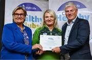 20 October 2023; The GAA is thrilled to announce and honor GAA clubs with the official &quot;Healthy Club&quot; designation. In recent years, Leinster clubs have actively taken part in the GAA's prominent Healthy Clubs pilot program, generously supported by Irish Life. Pictured are Rose Corcoran and Olivia Corcoran of The Downs club in Westmeath being presented with their foundation award by Leinster Council health and wellbeing chairperson Dave Murray at the Killeshin Hotel in Portlaoise, Laois. Photo by Brendan Moran/Sportsfile