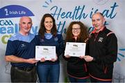 20 October 2023; The GAA is thrilled to announce and honor GAA clubs with the official &quot;Healthy Club&quot; designation. In recent years, Leinster clubs have actively taken part in the GAA's prominent Healthy Clubs pilot program, generously supported by Irish Life. Pictured are representatives from Meath with their gold awards, from left, James Kelly and Lisa McDonald of the St Colmcilles club and Caroline Walsh and Tony Walsh of the St Michael's club at the presentation in the Killeshin Hotel in Portlaoise, Laois. Photo by Brendan Moran/Sportsfile