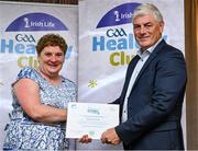 20 October 2023; The GAA is thrilled to announce and honor GAA clubs with the official &quot;Healthy Club&quot; designation. In recent years, Leinster clubs have actively taken part in the GAA's prominent Healthy Clubs pilot program, generously supported by Irish Life. Pictured is Geraldine Prendergast of the Trinity Gaels club in Dublin being presented with their foundation award by Leinster Council health and wellbeing chairperson Dave Murray at the Killeshin Hotel in Portlaoise, Laois. Photo by Brendan Moran/Sportsfile
