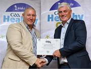 20 October 2023; The GAA is thrilled to announce and honor GAA clubs with the official &quot;Healthy Club&quot; designation. In recent years, Leinster clubs have actively taken part in the GAA's prominent Healthy Clubs pilot program, generously supported by Irish Life. Pictured is Thomas Kelly of the Ballyhale Shamrocks club in Kilkenny being presented with their silver award by Leinster Council health and wellbeing chairperson Dave Murray at the Killeshin Hotel in Portlaoise, Laois. Photo by Brendan Moran/Sportsfile