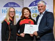 20 October 2023; The GAA is thrilled to announce and honor GAA clubs with the official &quot;Healthy Club&quot; designation. In recent years, Leinster clubs have actively taken part in the GAA's prominent Healthy Clubs pilot program, generously supported by Irish Life. Pictured are Chloe Dowling and Sarah Dunning of the St Laurence’s club in Kildare being presented with their silver award by Leinster Council health and wellbeing chairperson Dave Murray at the Killeshin Hotel in Portlaoise, Laois. Photo by Brendan Moran/Sportsfile