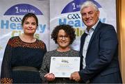 20 October 2023; The GAA is thrilled to announce and honor GAA clubs with the official &quot;Healthy Club&quot; designation. In recent years, Leinster clubs have actively taken part in the GAA's prominent Healthy Clubs pilot program, generously supported by Irish Life. Pictured are Cora Carter and Melissa Kally of the Young Irelands club in Kilkenny being presented with their gold award by Leinster Council health and wellbeing chairperson Dave Murray at the Killeshin Hotel in Portlaoise, Laois. Photo by Brendan Moran/Sportsfile