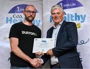 20 October 2023; The GAA is thrilled to announce and honor GAA clubs with the official &quot;Healthy Club&quot; designation. In recent years, Leinster clubs have actively taken part in the GAA's prominent Healthy Clubs pilot program, generously supported by Irish Life. Pictured is Aidan Gilleran of the Longford Slashers club in Longford being presented with their foundation award by Leinster Council health and wellbeing chairperson Dave Murray at the Killeshin Hotel in Portlaoise, Laois. Photo by Brendan Moran/Sportsfile