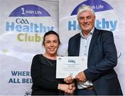 20 October 2023; The GAA is thrilled to announce and honor GAA clubs with the official &quot;Healthy Club&quot; designation. In recent years, Leinster clubs have actively taken part in the GAA's prominent Healthy Clubs pilot program, generously supported by Irish Life. Pictured are Majella O'Shea of the Aughrim club in Wicklow being presented with their foundation award by Leinster Council health and wellbeing chairperson Dave Murray at the Killeshin Hotel in Portlaoise, Laois. Photo by Brendan Moran/Sportsfile