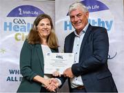 20 October 2023; The GAA is thrilled to announce and honor GAA clubs with the official &quot;Healthy Club&quot; designation. In recent years, Leinster clubs have actively taken part in the GAA's prominent Healthy Clubs pilot program, generously supported by Irish Life. Pictured is Rachel McGrane of the Annacurra club in Wicklow being presented with their silver award by Leinster Council health and wellbeing chairperson Dave Murray at the Killeshin Hotel in Portlaoise, Laois. Photo by Brendan Moran/Sportsfile