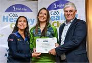 20 October 2023; The GAA is thrilled to announce and honor GAA clubs with the official &quot;Healthy Club&quot; designation. In recent years, Leinster clubs have actively taken part in the GAA's prominent Healthy Clubs pilot program, generously supported by Irish Life. Pictured are Ciara Fagan and Sinéad Ní Dhúill of the Éire Óg Greystones club in Wicklow being presented with their silver award by Leinster Council health and wellbeing chairperson Dave Murray at the Killeshin Hotel in Portlaoise, Laois. Photo by Brendan Moran/Sportsfile