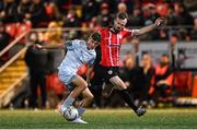 20 October 2023; Will Jarvis of Shelbourne in action against Cameron Dummigan of Derry City during the SSE Airtricity Men's Premier Division match between Derry City and Shelbourne at The Ryan McBride Brandywell Stadium in Derry. Photo by Ramsey Cardy/Sportsfile