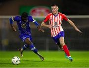 20 October 2023; Lee Devitt of Treaty United in action against Roland Idowu of Waterford during the SSE Airtricity Men's First Division match between Waterford and Treaty United at RSC in Waterford. Photo by Michael P Ryan/Sportsfile
