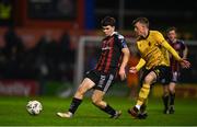 20 October 2023; James Clarke of Bohemians in action against Chris Forrester of St Patrick's Athletic during the SSE Airtricity Men's Premier Division match between Bohemians and St Patrick's Athletic at Dalymount Park in Dublin. Photo by Tyler Miller/Sportsfile