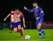 20 October 2023; Shane Griffin of Waterford in action against Colin Conroy of Treaty United during the SSE Airtricity Men's First Division match between Waterford and Treaty United at RSC in Waterford. Photo by Michael P Ryan/Sportsfile