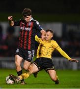 20 October 2023; James Clarke of Bohemians is tackled by Jamie Lennon of St Patrick's Athletic during the SSE Airtricity Men's Premier Division match between Bohemians and St Patrick's Athletic at Dalymount Park in Dublin. Photo by Tyler Miller/Sportsfile