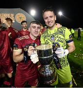 20 October 2023; Galway United players Ed McCarthy, left, and Brendan Clarke celebrate with the trophy after the SSE Airtricity Men's First Division match between Galway United and Wexford at Eamonn Deacy Park in Galway. Photo by Stephen McCarthy/Sportsfile