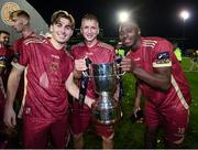 20 October 2023; Galway United players, from left, Ronan Manning, Stephen Walsh and Francely Lomboto celebrate with the trophy after the SSE Airtricity Men's First Division match between Galway United and Wexford at Eamonn Deacy Park in Galway. Photo by Stephen McCarthy/Sportsfile