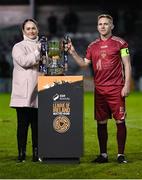 20 October 2023; Galway United captain Conor McCormack is presented with the trophy by SSE Airtricity marketing specialist Ruth Rapple after the SSE Airtricity Men's First Division match between Galway United and Wexford at Eamonn Deacy Park in Galway. Photo by Stephen McCarthy/Sportsfile