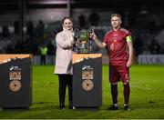20 October 2023; Galway United captain Conor McCormack is presented with the trophy by SSE Airtricity marketing specialist Ruth Rapple after the SSE Airtricity Men's First Division match between Galway United and Wexford at Eamonn Deacy Park in Galway. Photo by Stephen McCarthy/Sportsfile