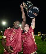 20 October 2023; Galway players Francely Lomboto, left, and Stephen Walsh celebrate with the trophy after the SSE Airtricity Men's First Division match between Galway United and Wexford at Eamonn Deacy Park in Galway. Photo by Stephen McCarthy/Sportsfile