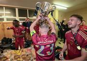 20 October 2023; Galway United captain Conor McCormack celebrates with the trophy in the dressing room after the SSE Airtricity Men's First Division match between Galway United and Wexford at Eamonn Deacy Park in Galway. Photo by Stephen McCarthy/Sportsfile