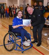 21 October 2023; GAA Carlow county chairperson Jim Bolger presents Ireland player Ellen Sheehy of Munster with a commemorative plaque for their trip to Prague earlier this year before the 2023 Wheelchair Hurling / Camogie All Ireland Finals at SETU Carlow Sports Hall in Carlow. Photo by Ben McShane/Sportsfile