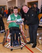 21 October 2023; GAA Carlow county chairperson Jim Bolger presents Ireland player Alex Hennebry of Leinster with a commemorative plaque for their trip to Prague earlier this year before the 2023 Wheelchair Hurling / Camogie All Ireland Finals at SETU Carlow Sports Hall in Carlow. Photo by Ben McShane/Sportsfile