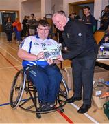21 October 2023; GAA Carlow county chairperson Jim Bolger presents Ireland player Shane Curran of Connacht with a commemorative plaque for their trip to Prague earlier this year before the 2023 Wheelchair Hurling / Camogie All Ireland Finals at SETU Carlow Sports Hall in Carlow. Photo by Ben McShane/Sportsfile