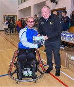 21 October 2023; GAA Carlow county chairperson Jim Bolger presents Ireland player James McCarthy of Munster with a commemorative plaque for their trip to Prague earlier this year before the 2023 Wheelchair Hurling / Camogie All Ireland Finals at SETU Carlow Sports Hall in Carlow. Photo by Ben McShane/Sportsfile