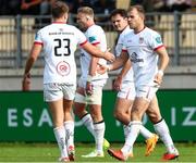 21 October 2023; Ulster players celebrate their side's first try, scored by Jake Flannery, not pictured, during the United Rugby Championship match between Zebre Parma and Ulster at Stadio Sergio Lanfranchi in Parma, Italy. Photo by Massimiliano Carnabuci/Sportsfile