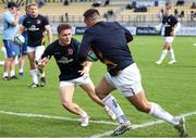 21 October 2023; Mike Lowry, left, and James Hume of Ulster warm up before the United Rugby Championship match between Zebre Parma and Ulster at Stadio Sergio Lanfranchi in Parma, Italy. Photo by Massimiliano Carnabuci/Sportsfile