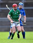21 October 2023; Thomas Monaghan of Ireland in action against John Gilles of Scotland during the 2023 Hurling Shinty International Game between Ireland and Scotland at Páirc Esler in Newry, Down. Photo by Piaras Ó Mídheach/Sportsfile