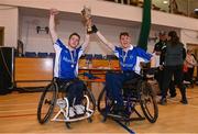 21 October 2023; Munster captain Cian Horgan, left, and vice-captain Darren Dineen lift the cup after the 2023 Wheelchair Hurling / Camogie All Ireland Final match between Ulster and Munster at SETU Carlow Sports Hall in Carlow. Photo by Ben McShane/Sportsfile