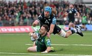 21 October 2023; Caolin Blade of Connacht dives over to score his side's first try despite the efforts of Justin Tipuric of Ospreys during the United Rugby Championship match between Connacht and Ospreys at The Sportsground in Galway. Photo by Tyler Miller/Sportsfile