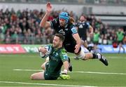 21 October 2023; Caolin Blade of Connacht dives over to score his side's first try despite the efforts of Justin Tipuric of Ospreys during the United Rugby Championship match between Connacht and Ospreys at The Sportsground in Galway. Photo by Tyler Miller/Sportsfile